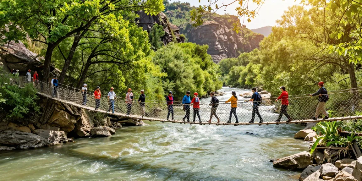 Group crossing a River Rope Bridge in a scenic river landscape, showcasing adventure and connection.